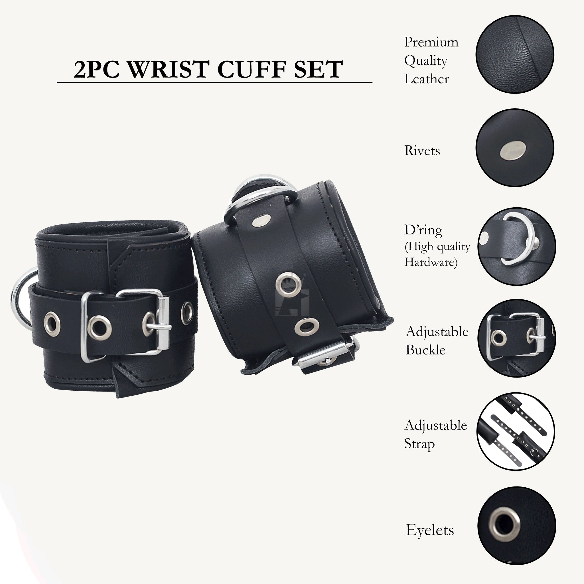 A set of black leather bondage handcuffs with metal buckles and eyelets, arranged on a white surface.