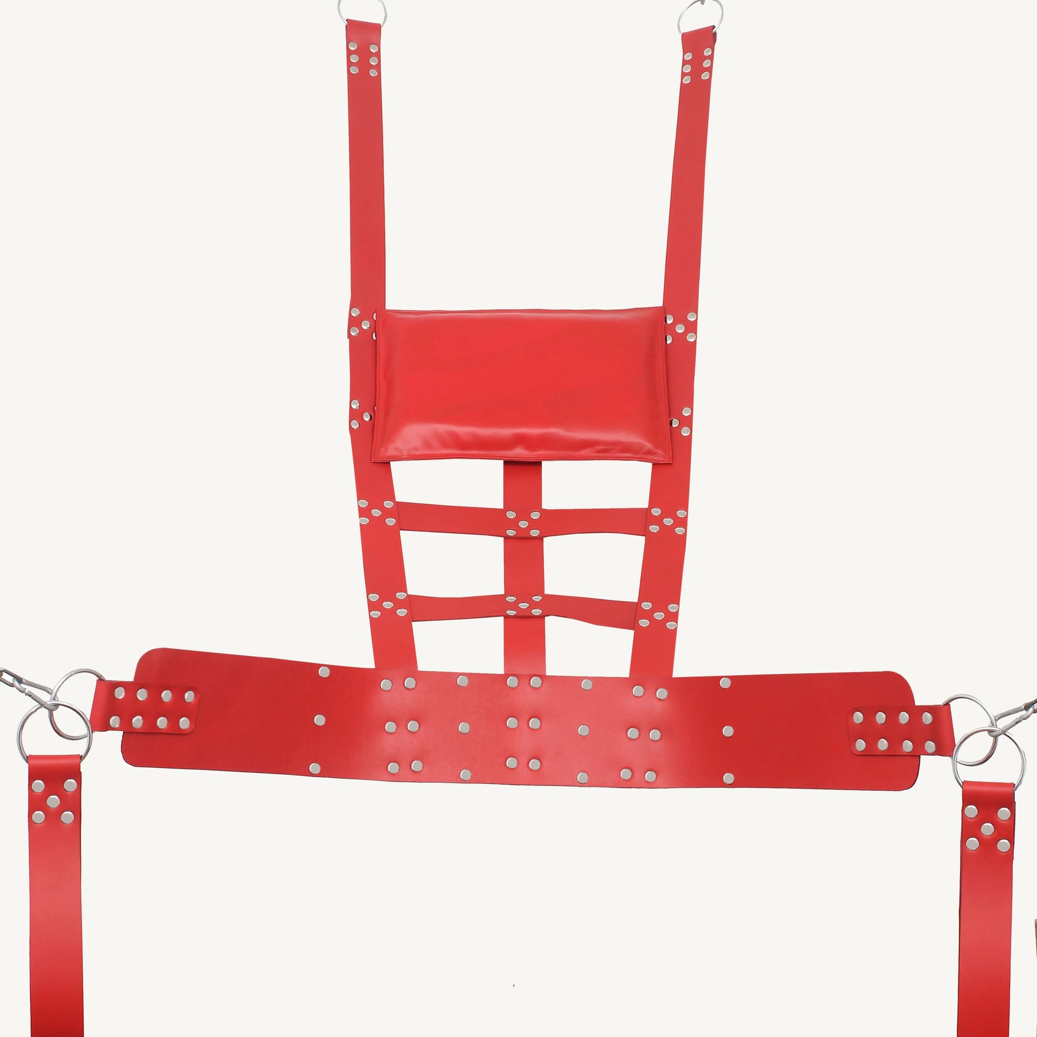 front angle view of black leather sex swing with comfort pillow, leg loops and nickel-plated reverts on it in a white background