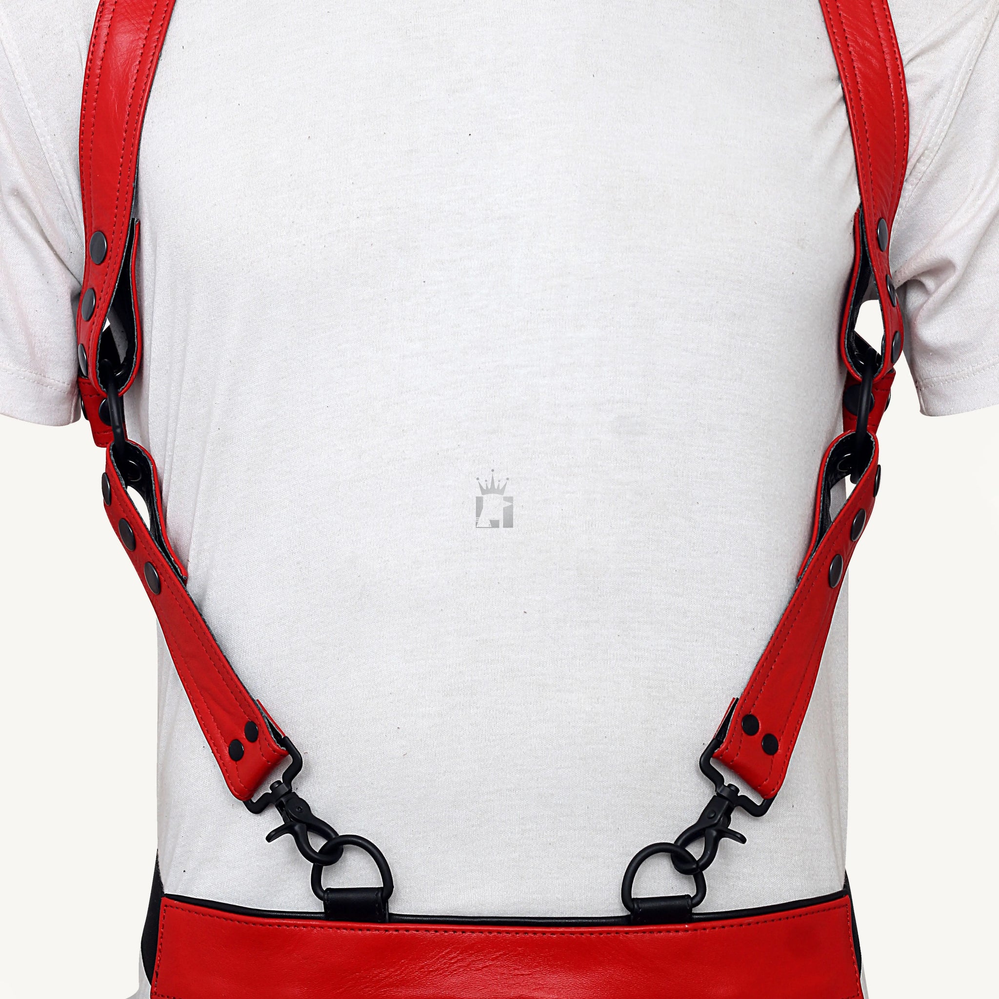 Backshot view of men wearing a red Genuine Leather Bondage Harness with Adjustable Strap with jockstraps on a light yellow background