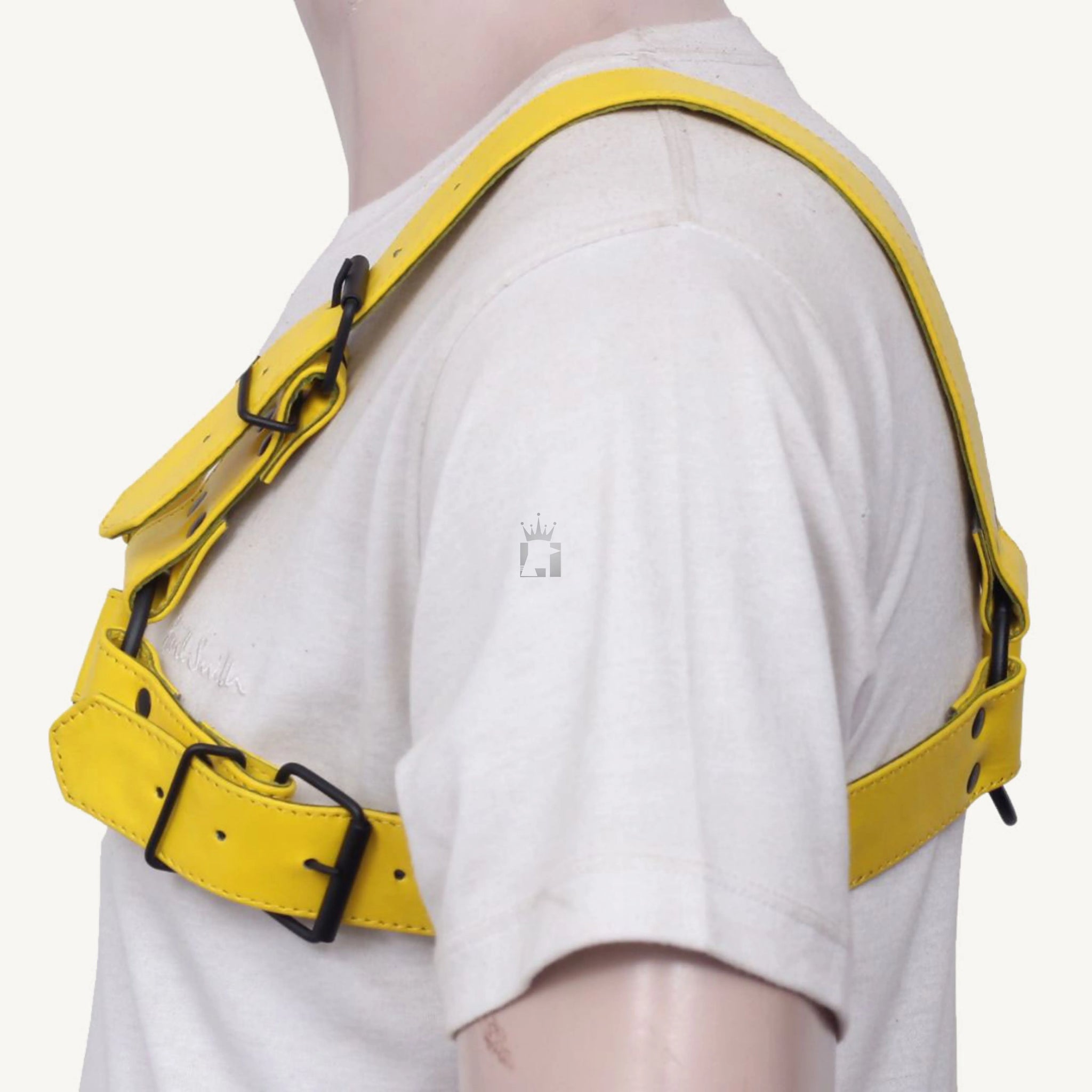 
left-side angle view of a dummy wearing a white shirt with a black leather chest bondage harness with nickel-plated reverts on it on a white background