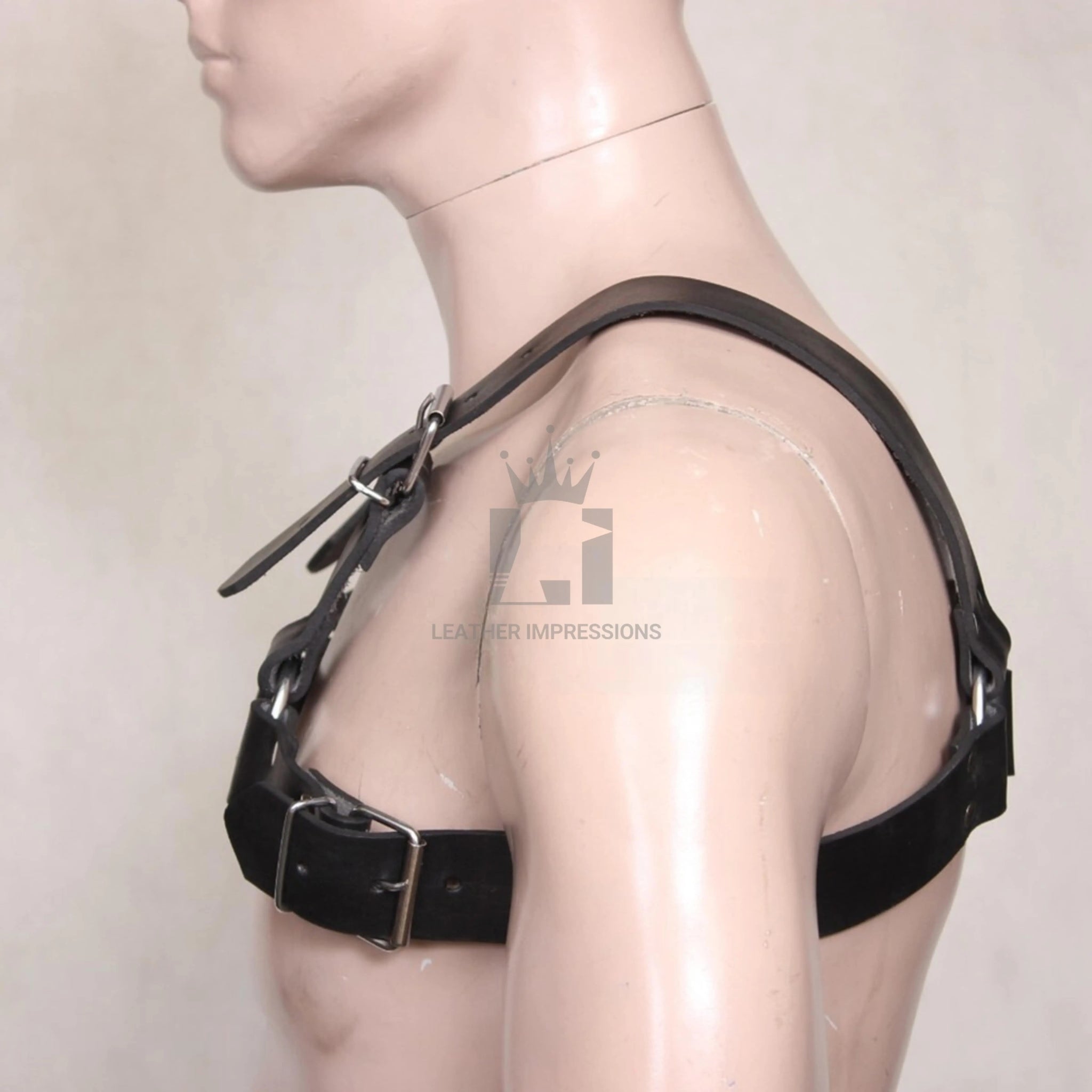 Left Side angle view of a Leather Harness with Multiple O-Rings and Adjustable Straps on a white background