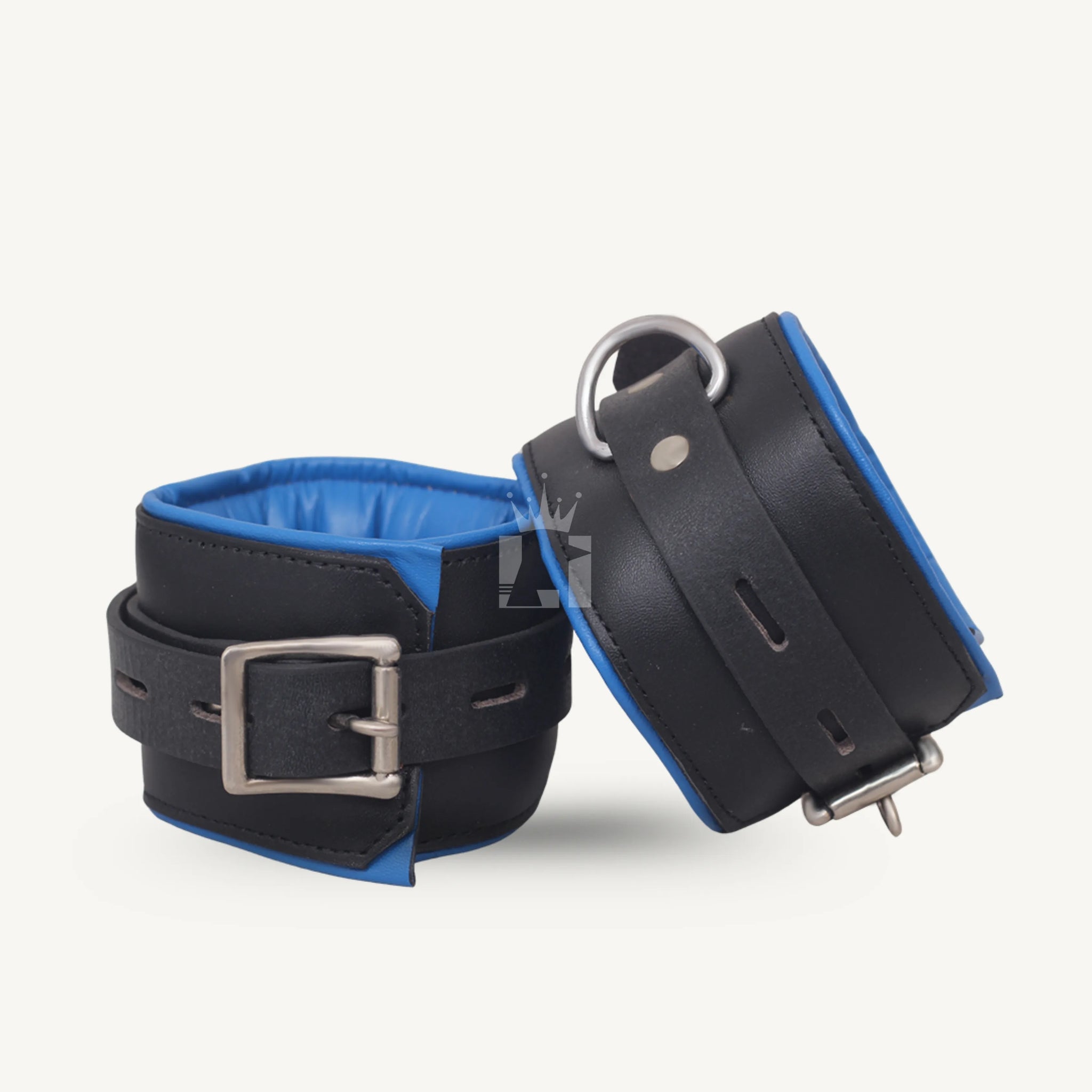 Two padded ankle cuffs made of black leather with blue interior, featuring adjustable buckle fastening and sturdy D-rings.