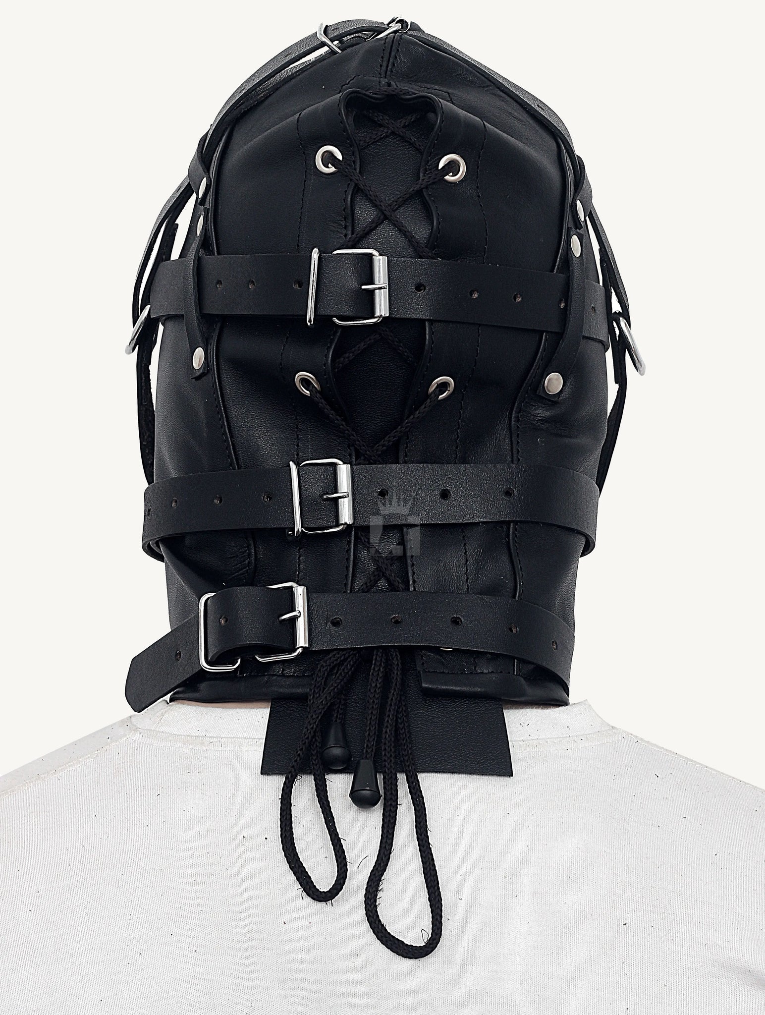 Backside angle view of a dummy wearing a black Triple Straps Leather Bondage Hood with laces on a white background