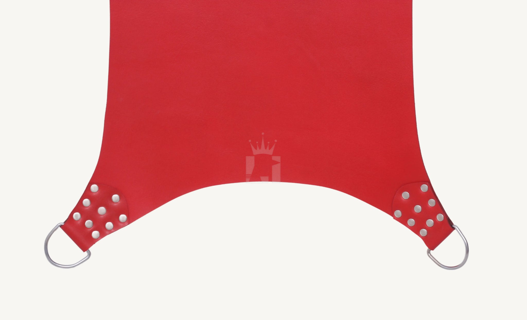 Close-up of lower section of red leather sex sling showing riveted D-rings for attachment.
