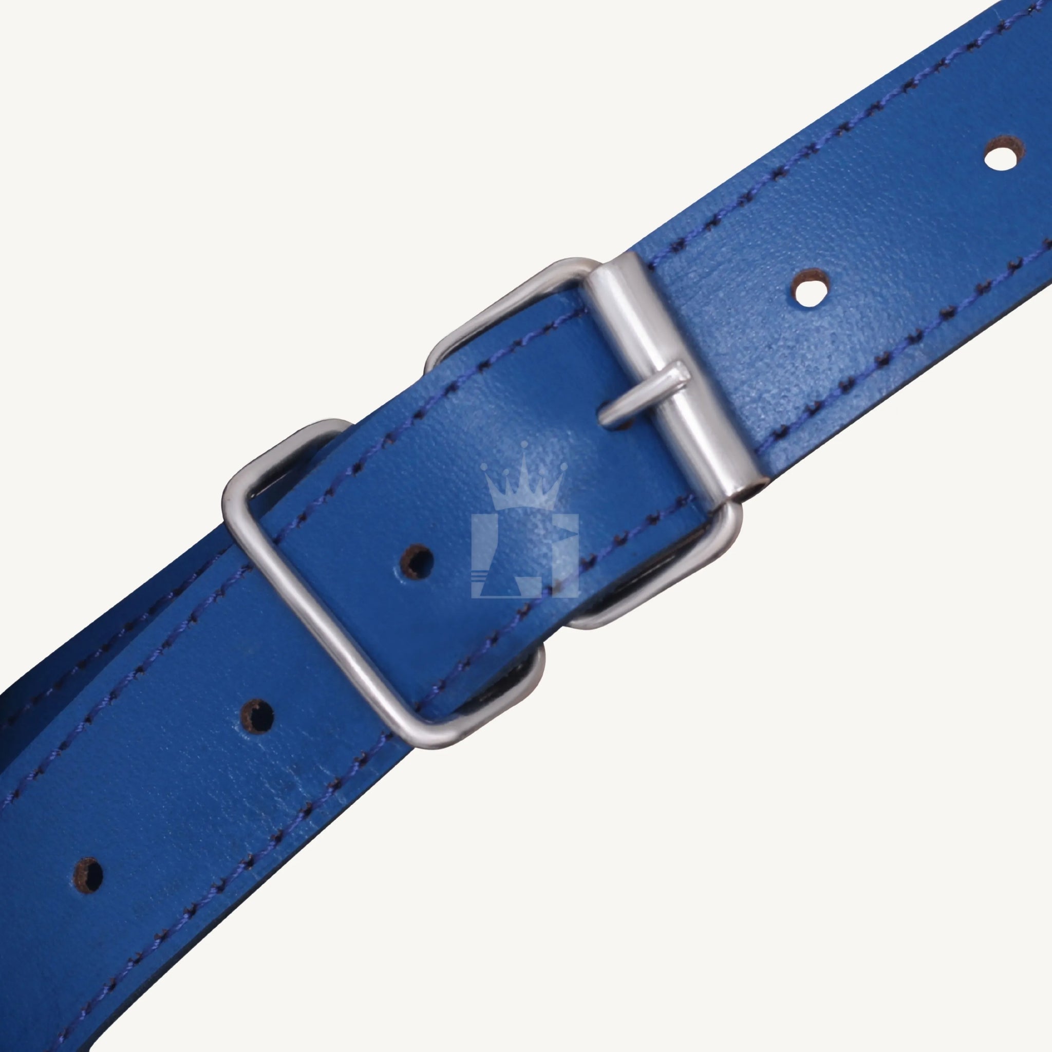 Detailed close-up of the blue leather Bondage  muzzle adjustable buckle strap with stitching.