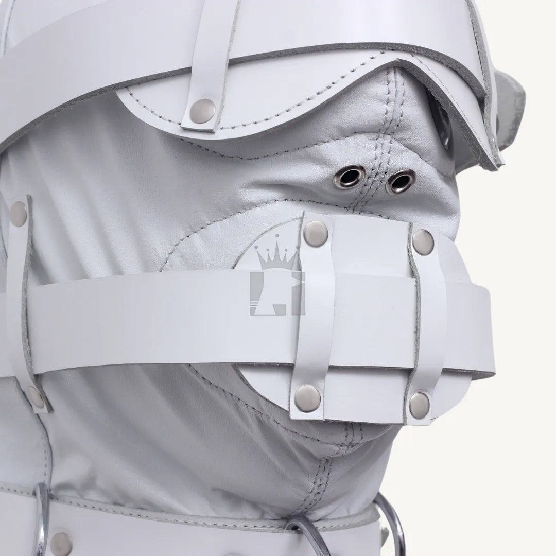 Detailed close-up of mouth strap with rivets and ventilation eyelets on white leather bondage hood.