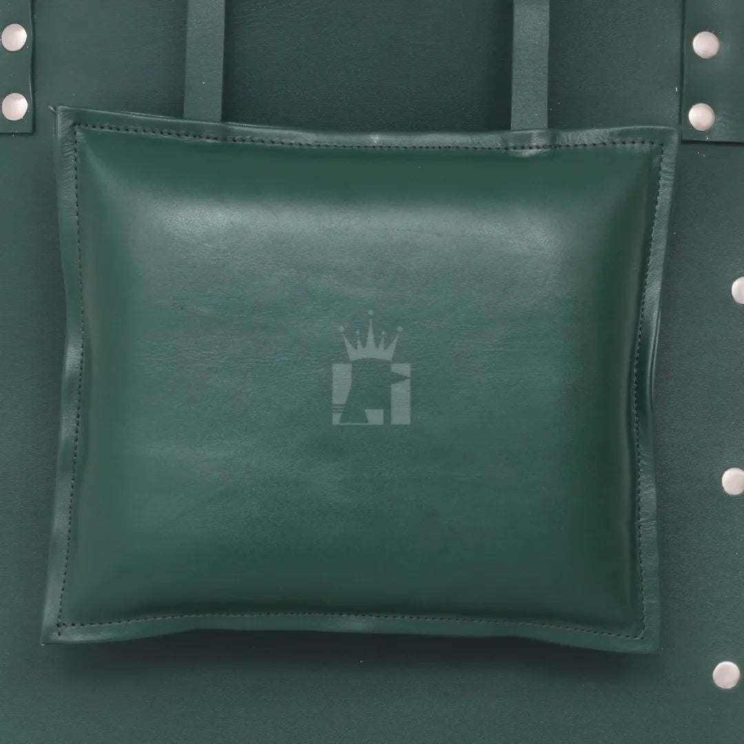 Detailed view of padded green leather pillow attached to bondage sling.