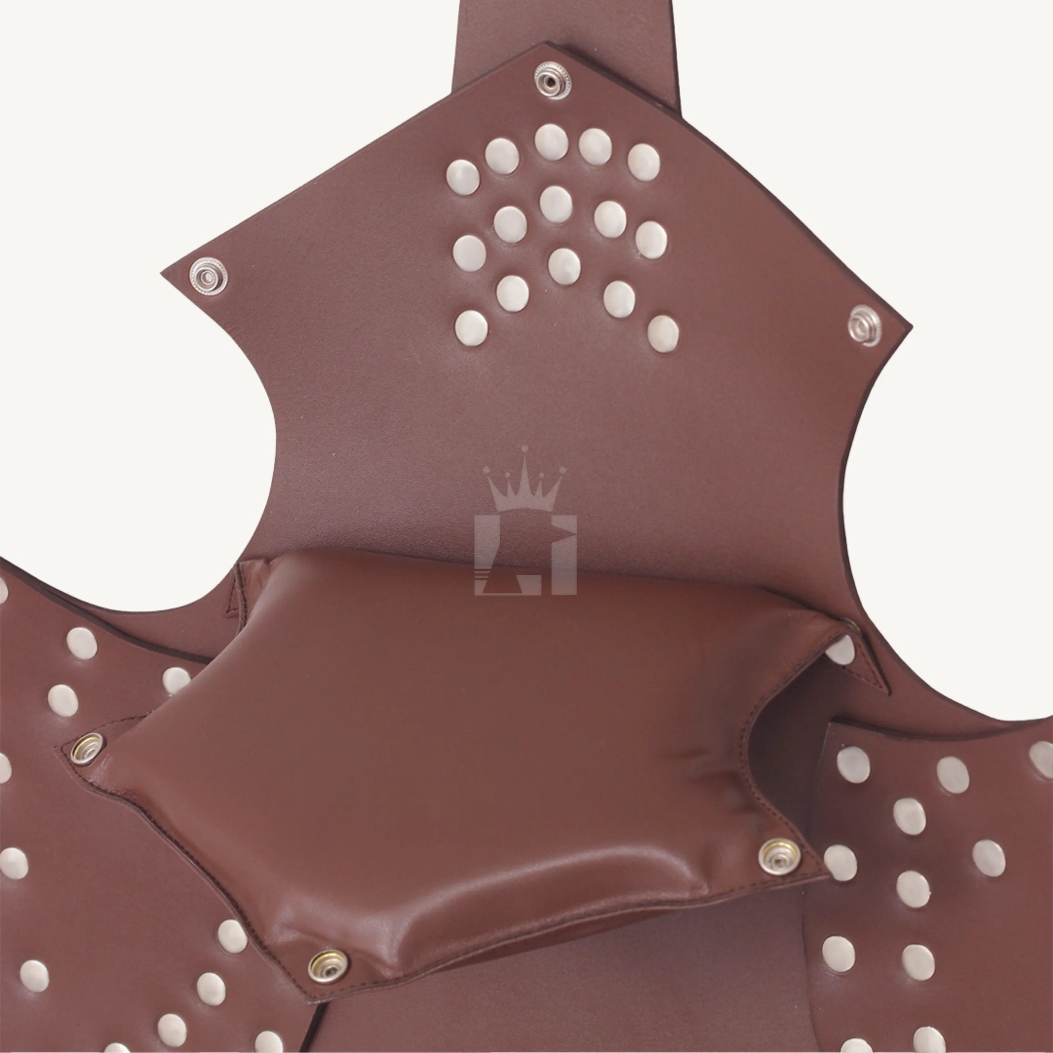 Close-up of brown leather sex sling showing detachable padded pillow with snap buttons and rivet details.
