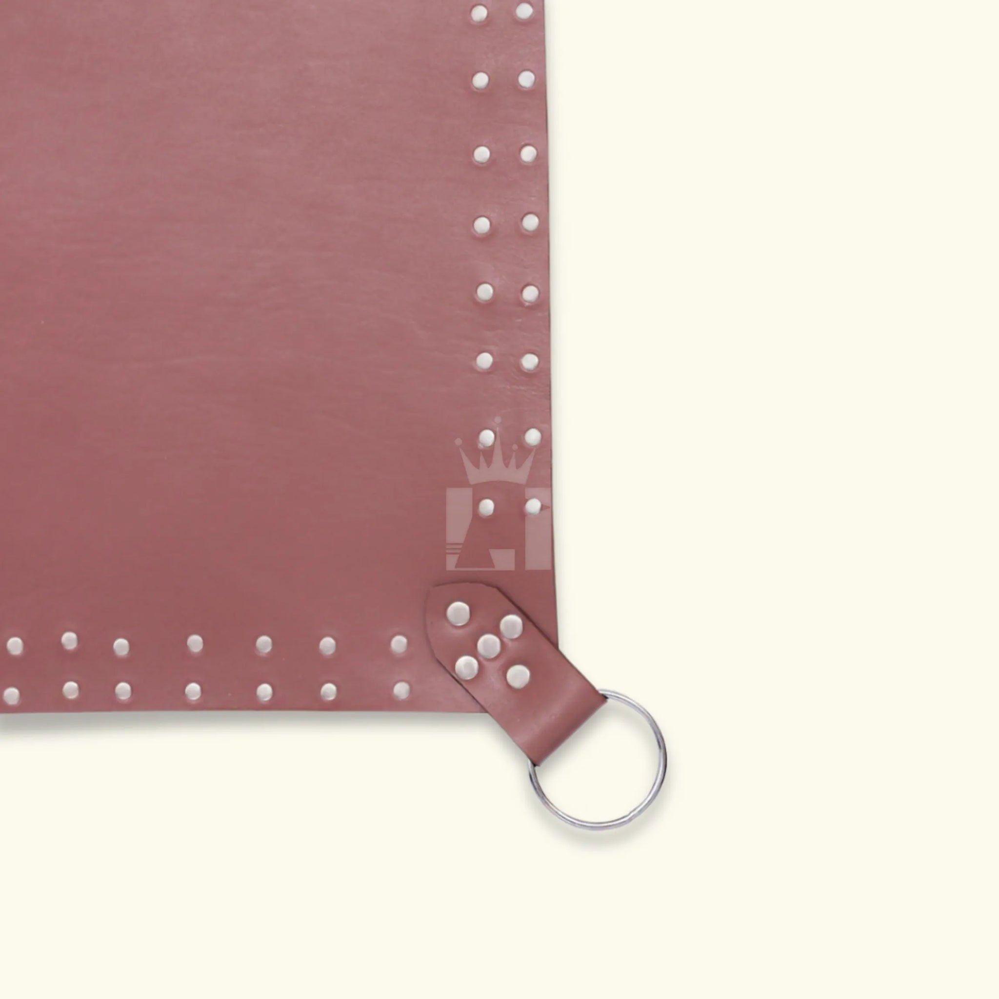 Close-up of riveted corner section of the brown leather sex sling with steel O-ring and leather strap.