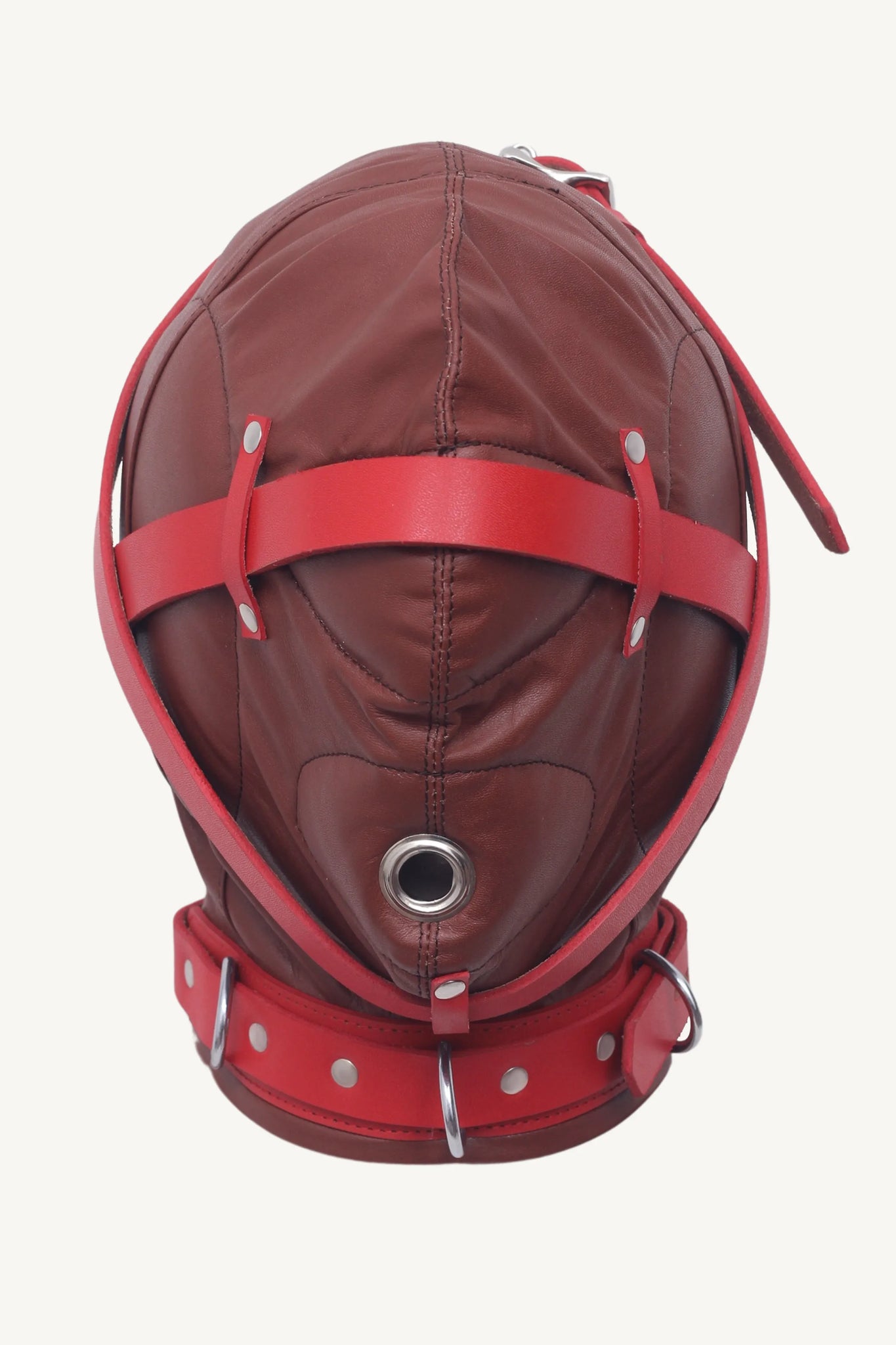 Front view of leather bondage hood with red straps crossing over the face and central breathing hole.