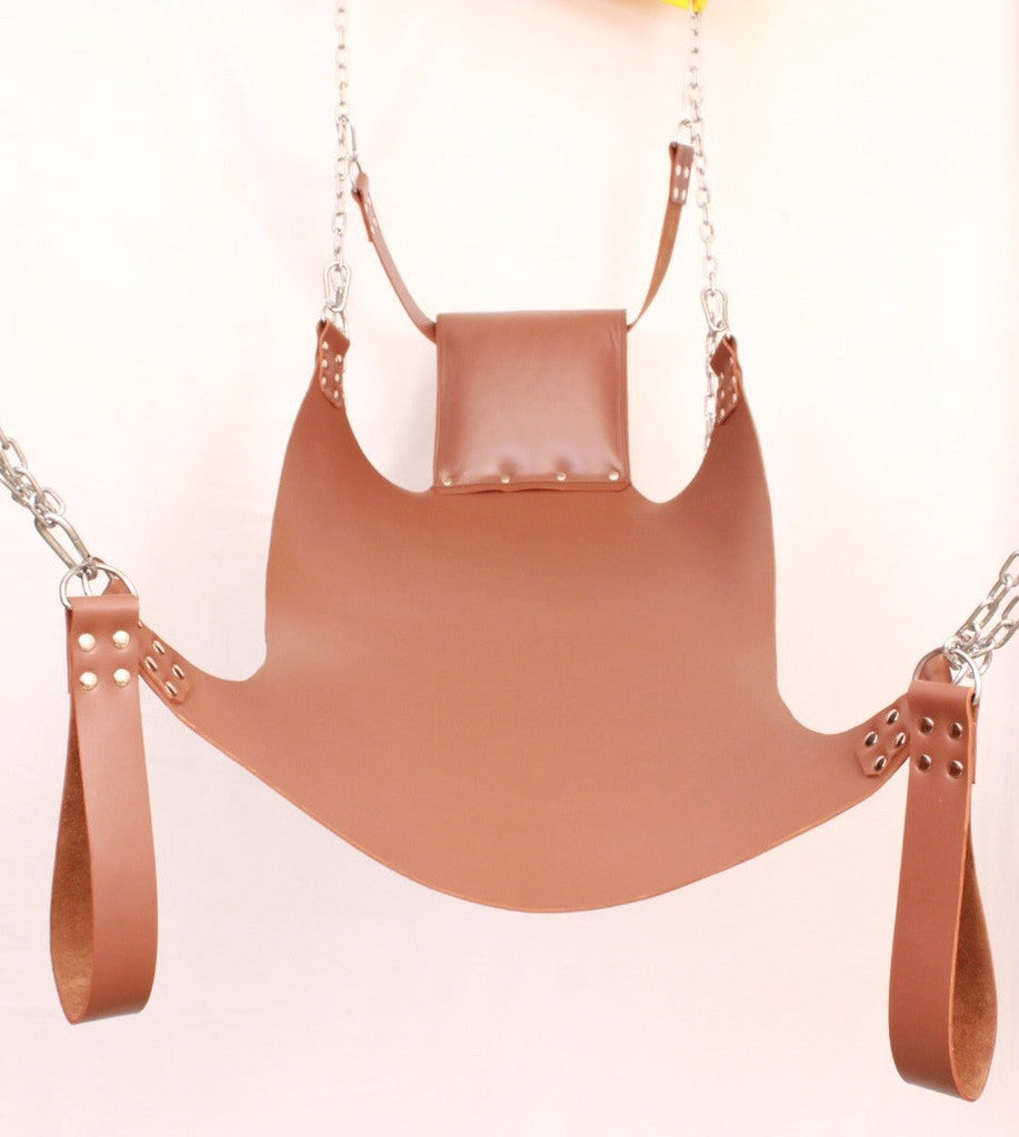 Front angle view of brow leather sex swing with leg loops, pillow and d'rings, nickel-plated reverts in a white background