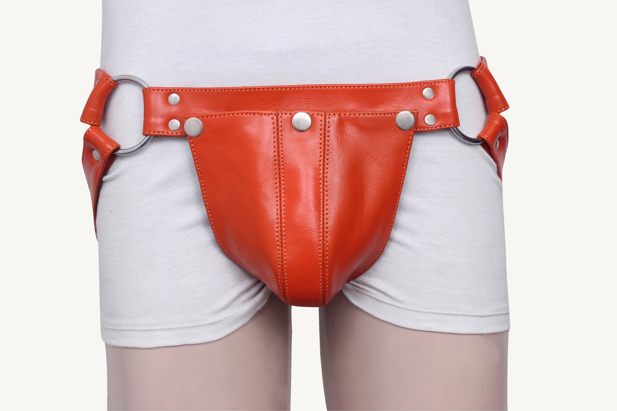 front angle view of leather jockstrap with removable front pouch and metal O-ring strap accents.