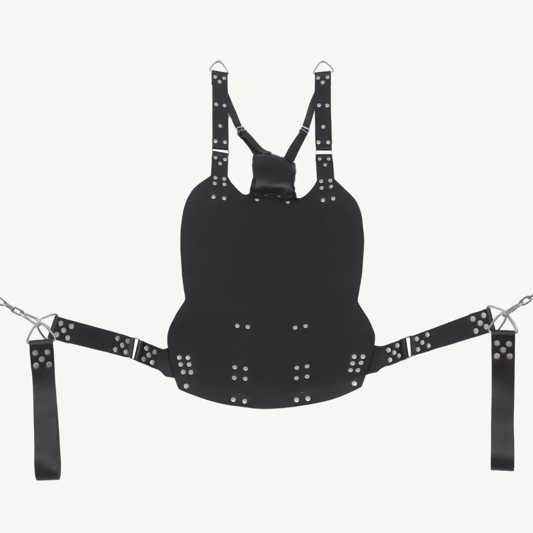 Full view of a black genuine leather sex sling with pillow support, riveted straps, and steel chain attachments.