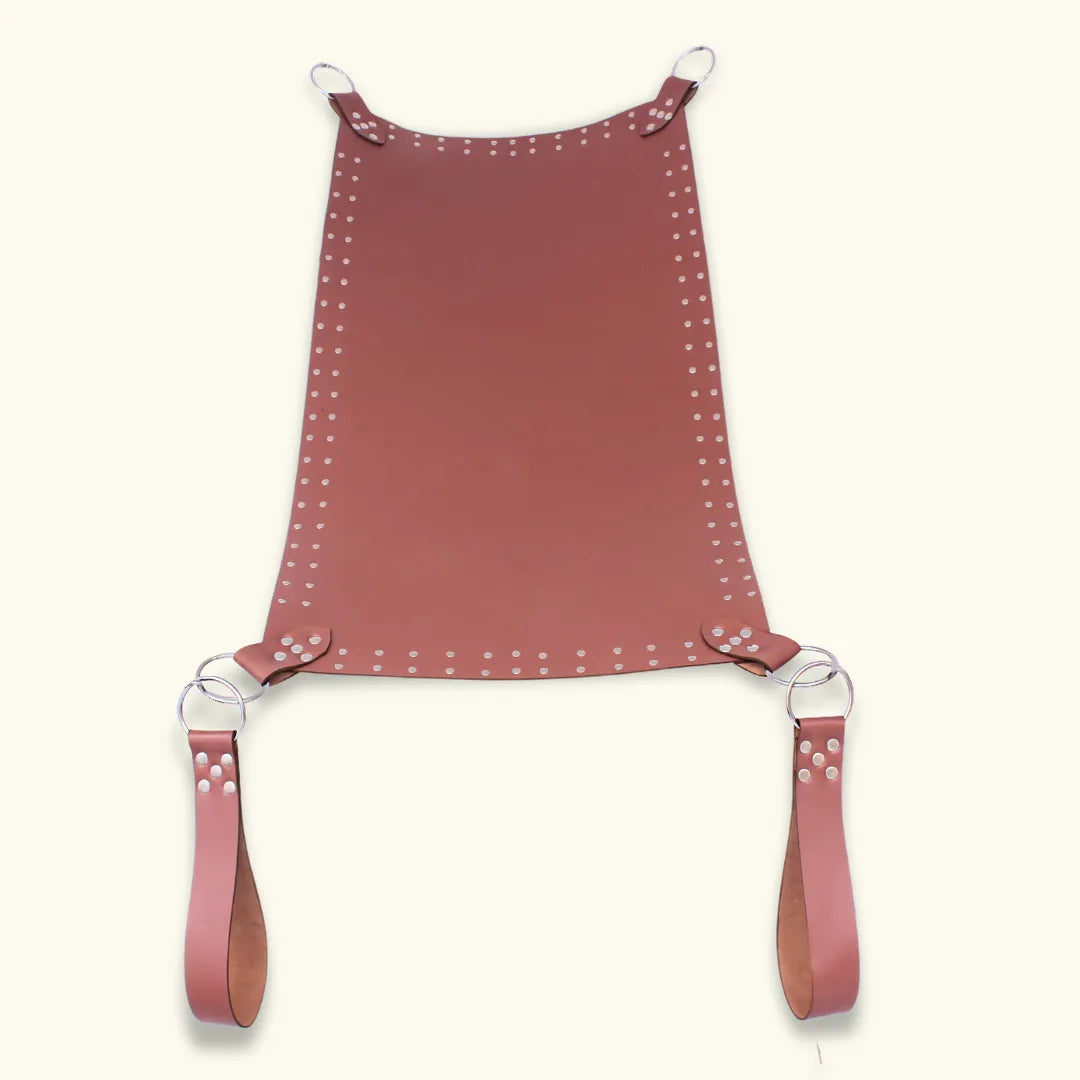 Full view of brown leather sex sling with riveted edges, steel O-rings, and detachable straps.