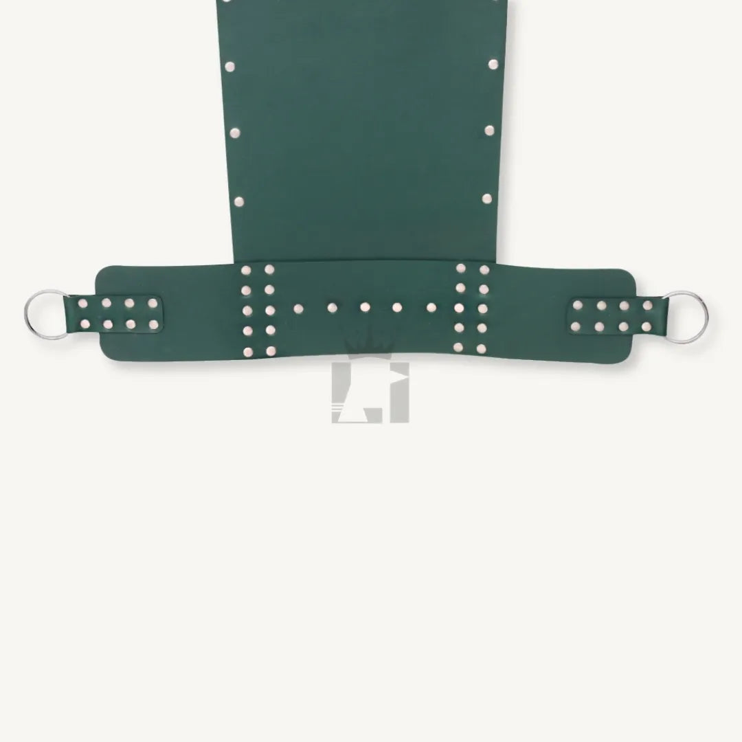 Detailed view of the riveted lower strap section on green leather bondage sling with sturdy design.