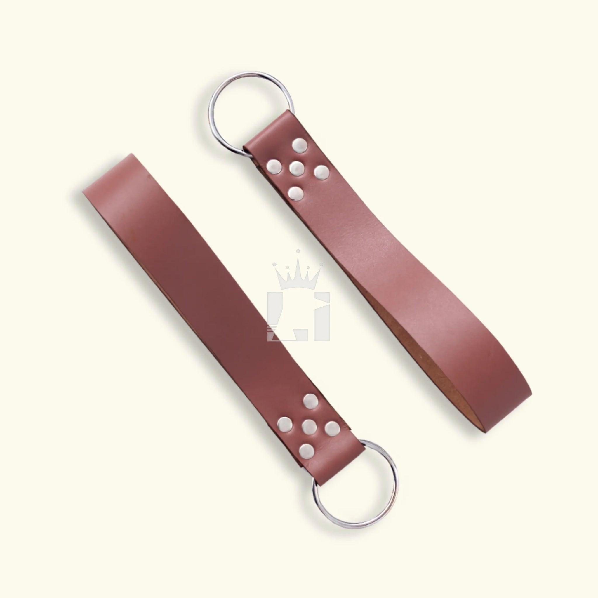 Two detachable brown leather straps with steel O-rings and riveted ends for sling suspension.