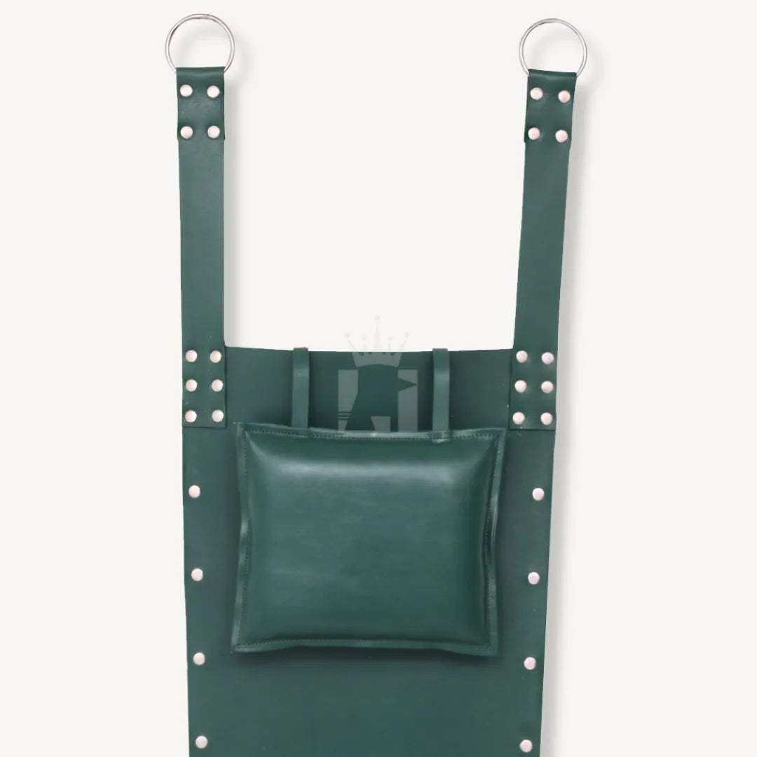 Close-up of padded green leather pillow attached to bondage sling with riveted straps and D-rings.
