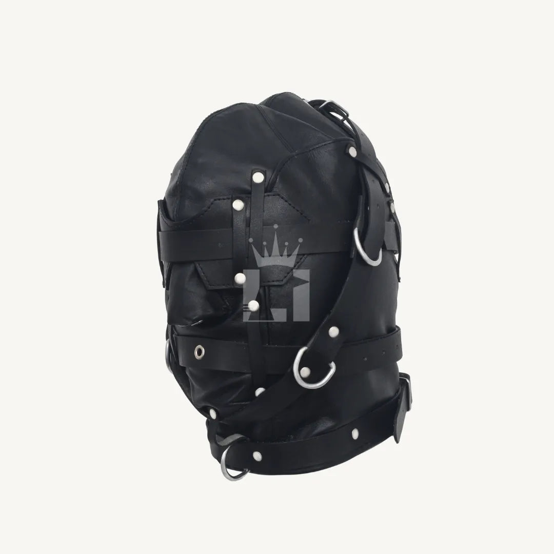 Side view of black leather bondage hood with multiple straps, rivets, and D-rings.