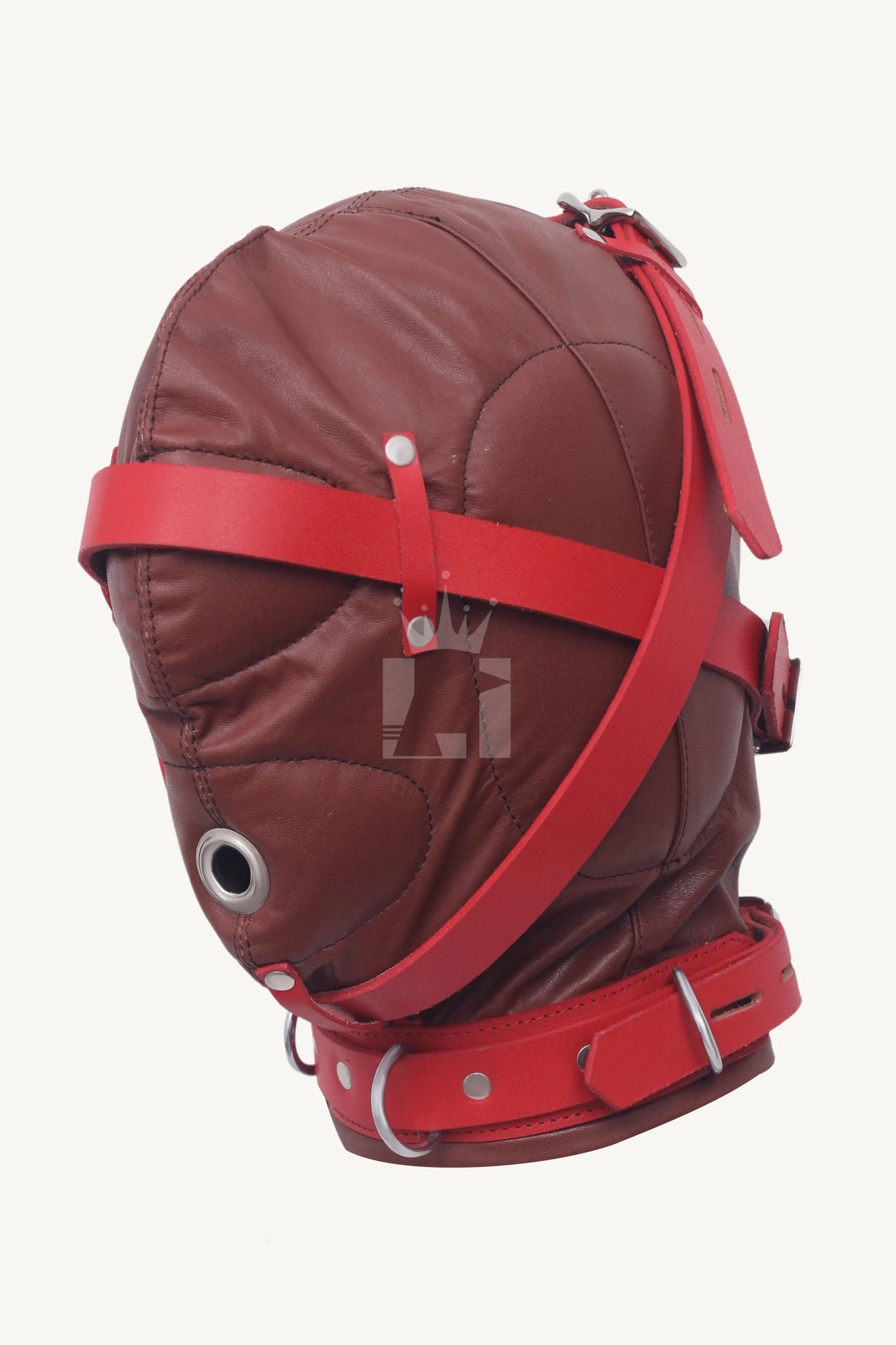 Side view of a brown leather bondage hood with red straps, silver rivets, and breathing hole.