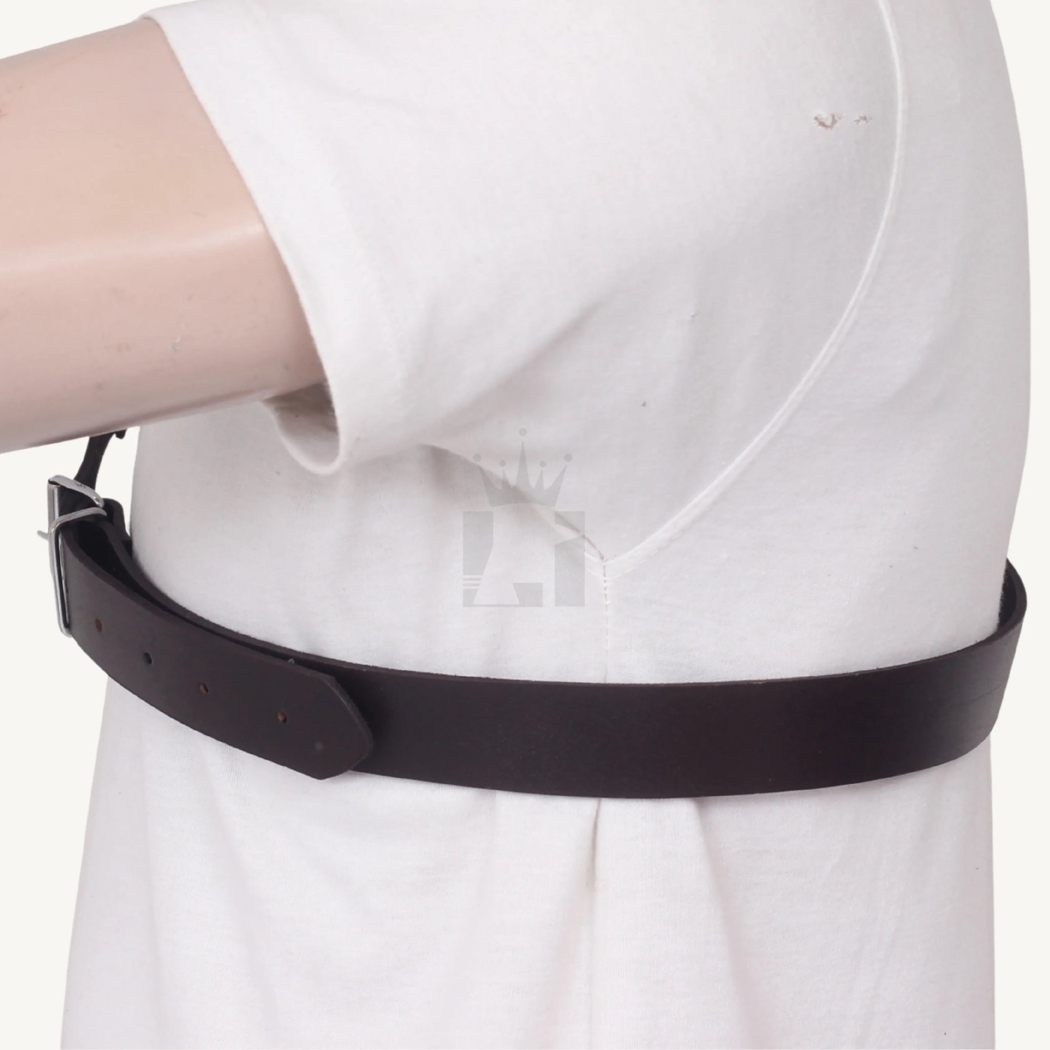 Side profile of brown leather Chest harness wrapping around chest with buckle closure.