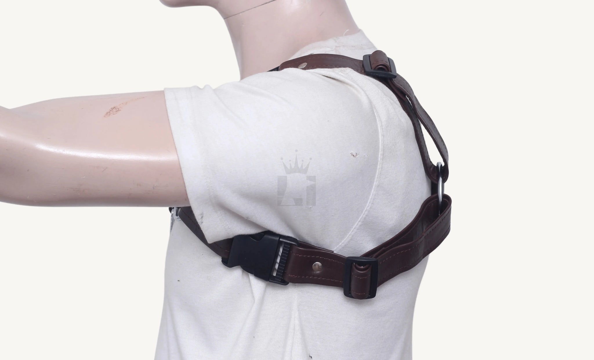 Side view of brown leather harness showing adjustable strap and black buckle closure on mannequin.