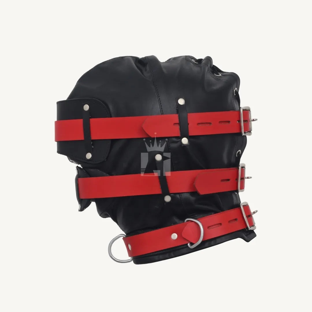 Side profile of black bondage hood with red leather straps, silver rivets, and D-rings.