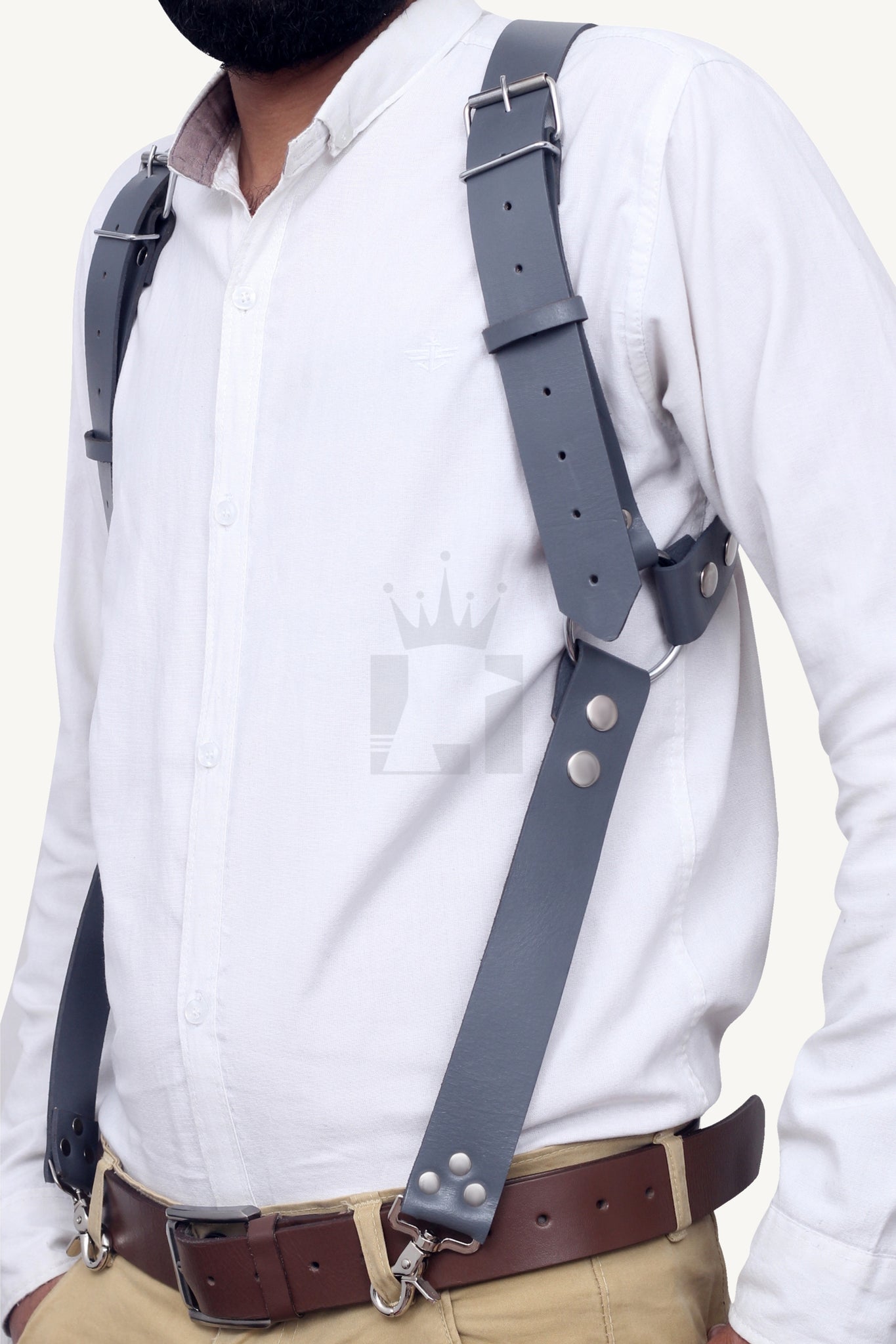 Man wearing black leather harness with adjustable straps and buckles.