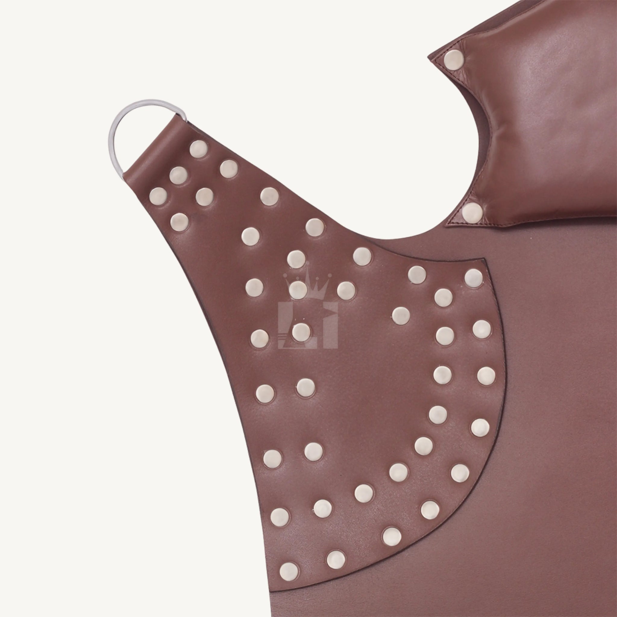 Side wing of brown padded leather sex sling featuring riveted reinforcement and steel D-ring connector.