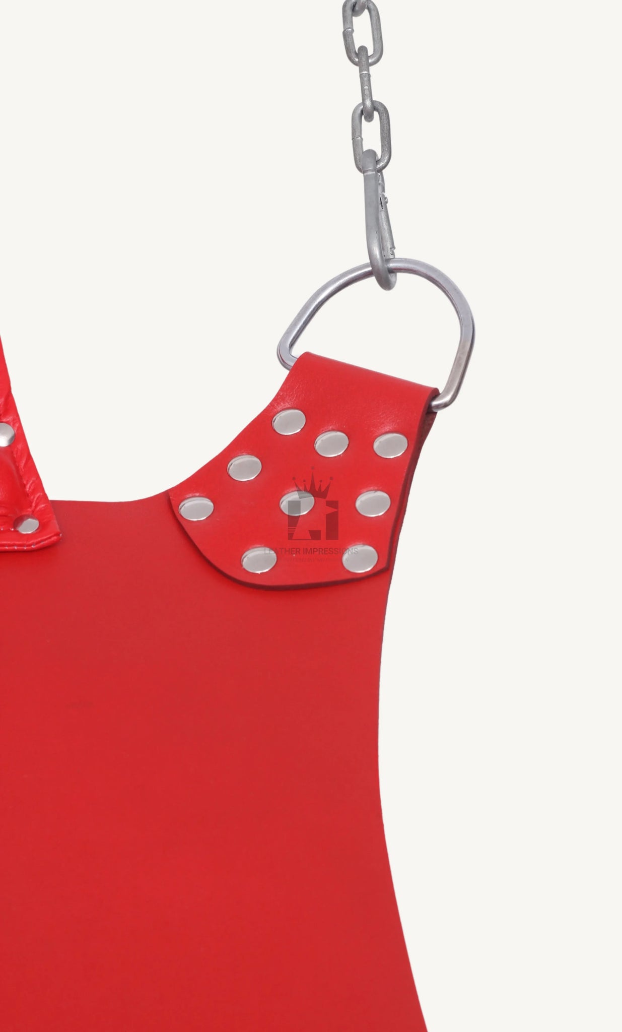 close-up shot of red leather sex swing one corse with nickels holding chain on white background 