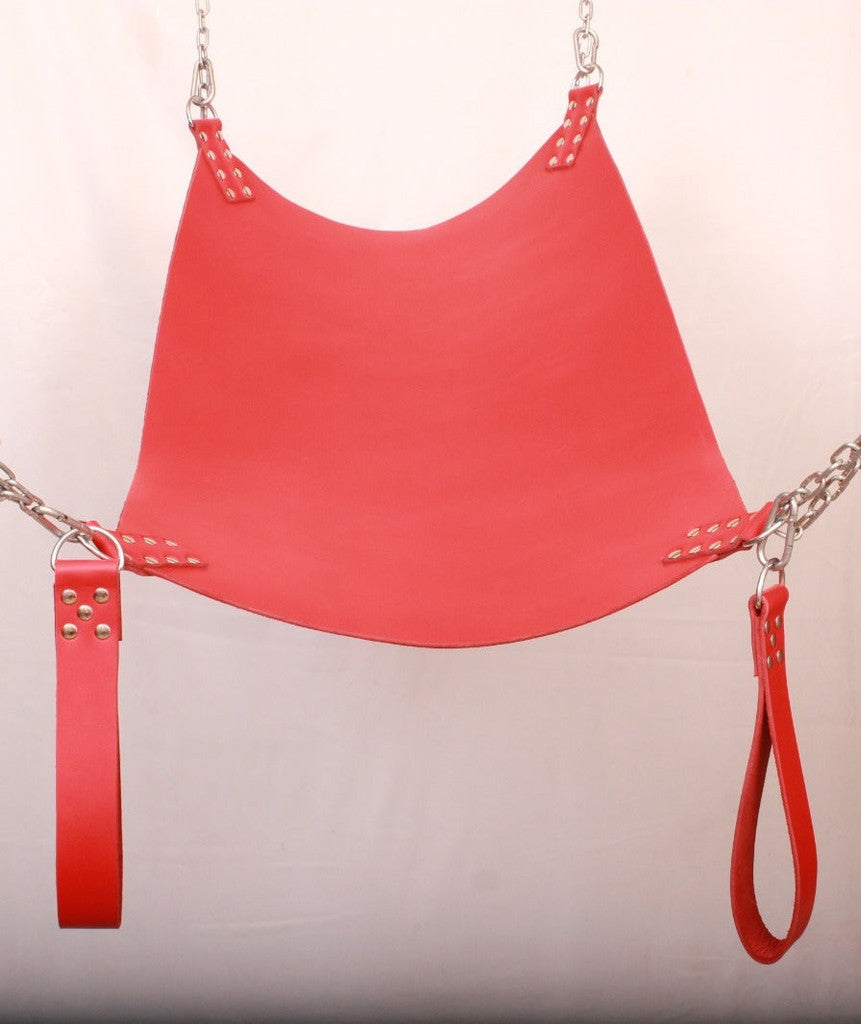 front angle view of red leather sex swing with leg loops, D'rings and nickel-plated reverts in a white background