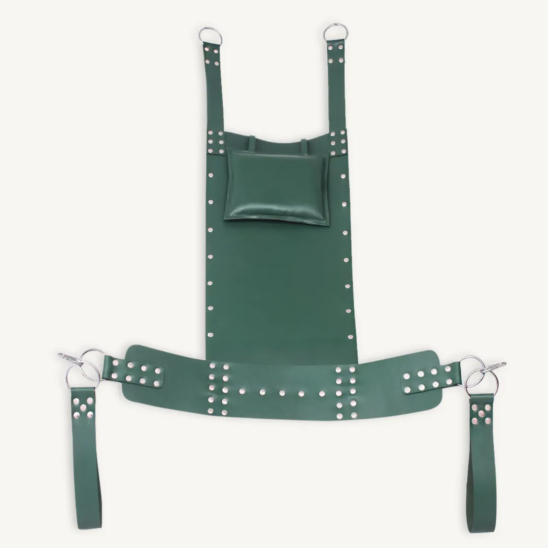 Full view of green leather bondage sling with attached pillow, riveted design, and suspension straps.