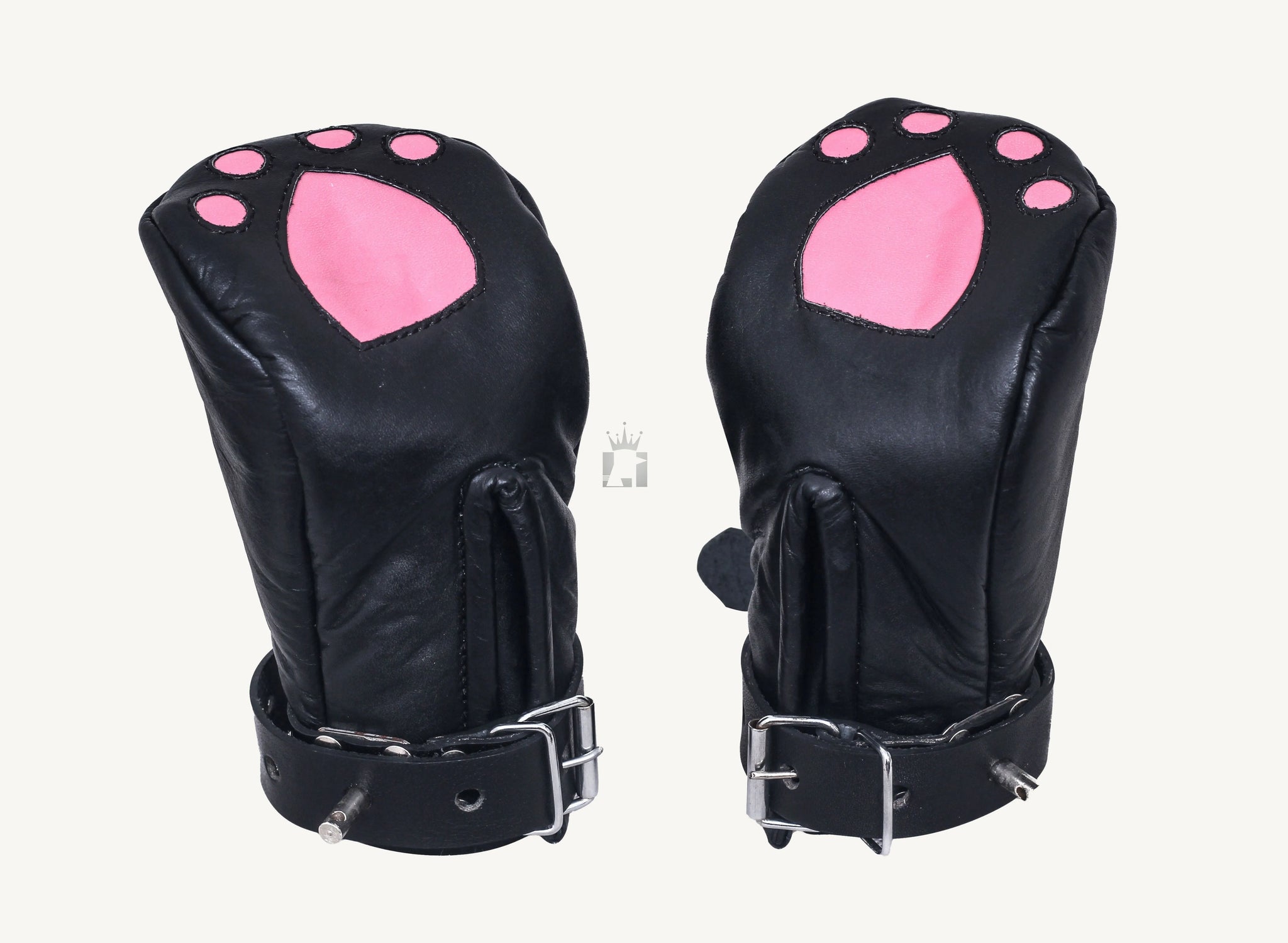 Rear side view of the same black leather cat paw bondage mittens, showing a smooth, padded finish without decoration. The buckled wrist straps are visible, along with metal D-rings likely used for fastening or attachment.